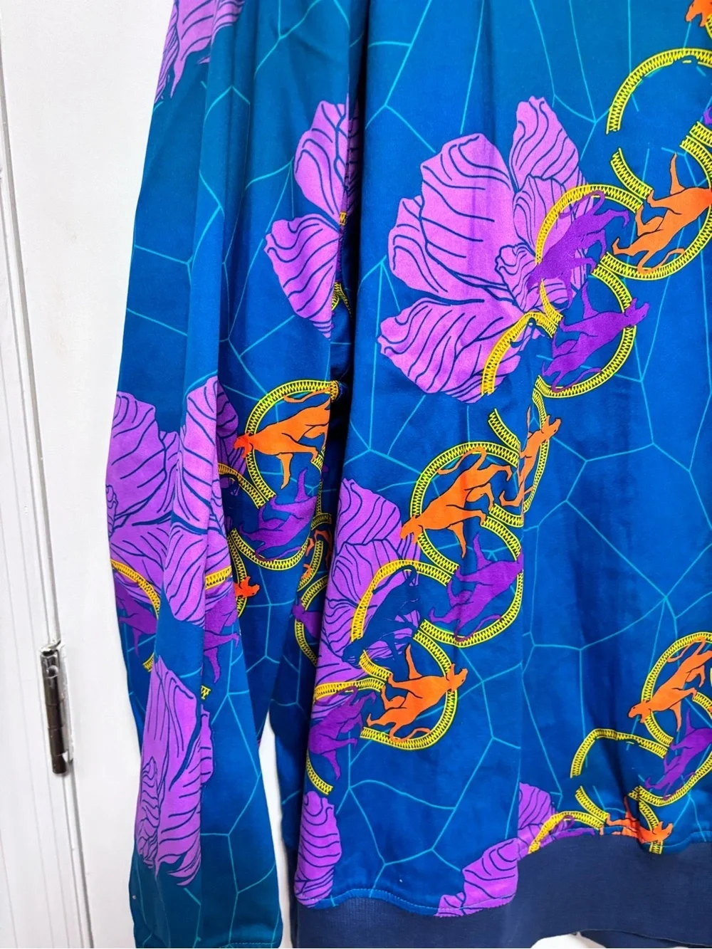 Reversible Marvel Blue Bomber Jacket with Purple Floral and Orange Chain Details